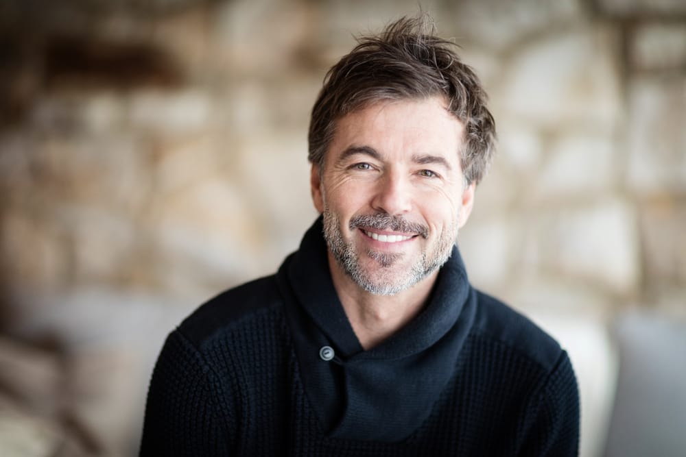 Middle aged man smiling - Dental Implants Orlando