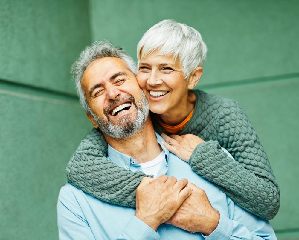 elderly couple playfully posing for a photo