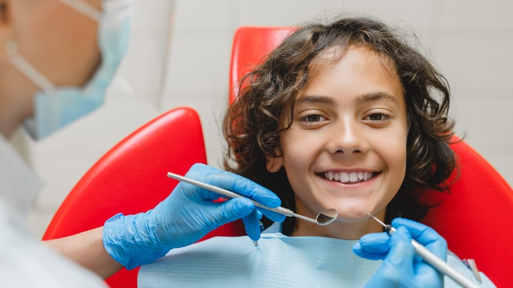 boy with perfect white ideal smile - Pediatric Dentist in Kissimmee