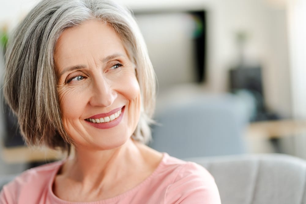 female with stylish gray hair - Dentist in Orlando FL