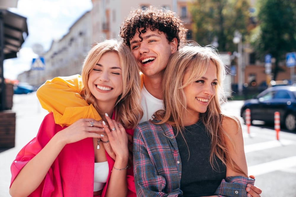 friends posing in the street - Dentist in Winter Park