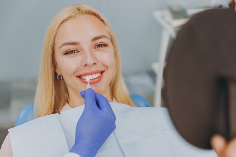 A patient receives an in-office teeth whitening treatment from a dental professional, demonstrating advanced cosmetic dentistry and immediate results in Orlando – Teeth Whitening Orlando.