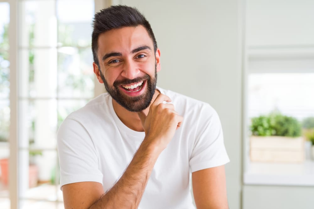 Smiling bearded man at home - Root Canal Kissimmee