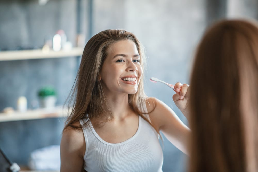 woman brushing her teeth
